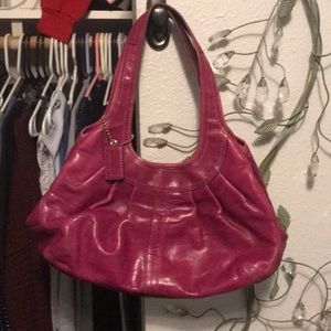 Magenta distressed leather COACH satchel.